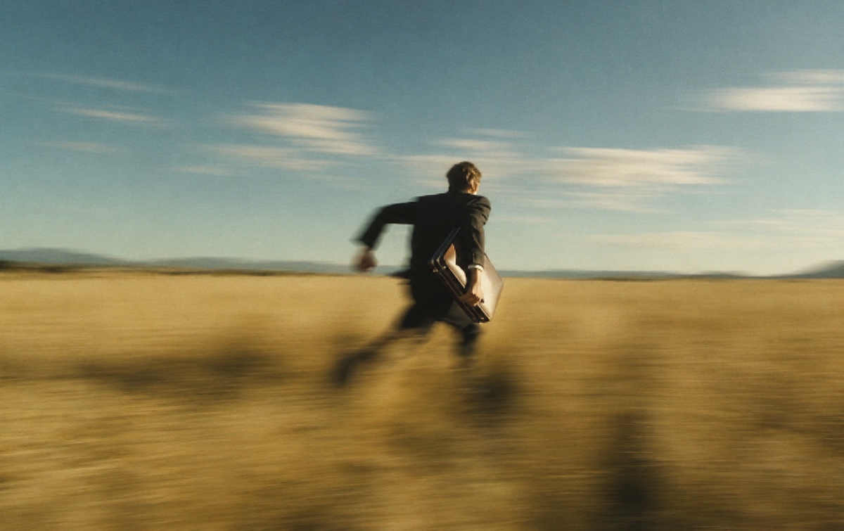 Runner crossing an open field